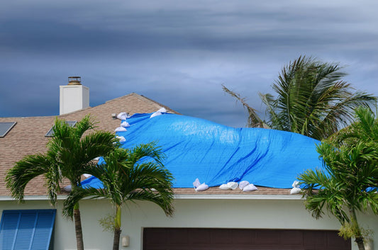 lumber tarp covering rooftop for safety before hurricane