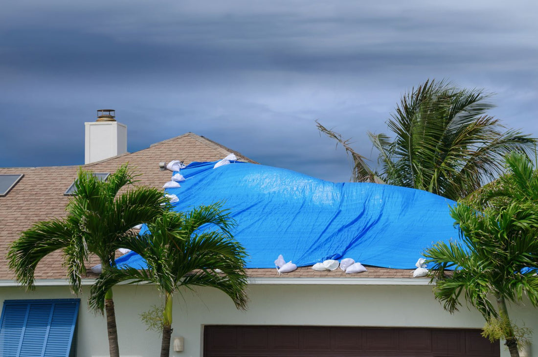 lumber tarp covering rooftop for safety before hurricane