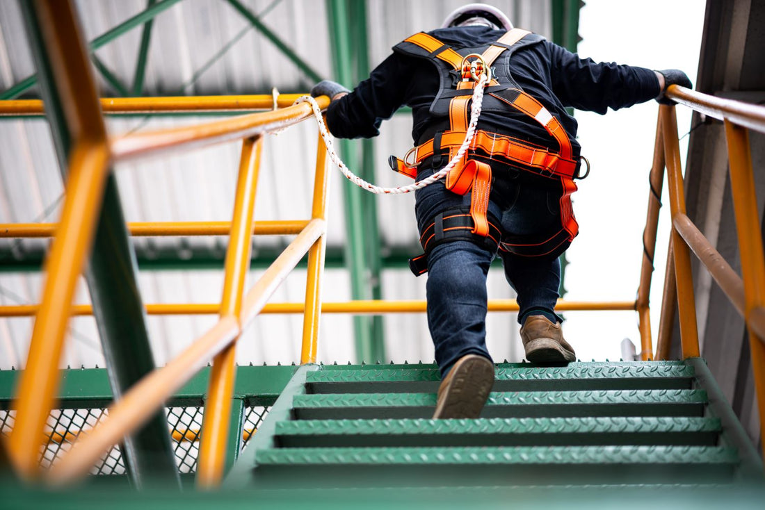 man wearing safety harness and line as fall protection