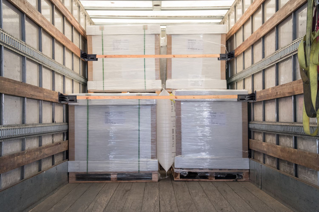 dunnage bag in between two cargo crates inside enclosed trailer