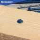 Blue concrete screw on a wooden surface with 'Conquest' branding in the corner.